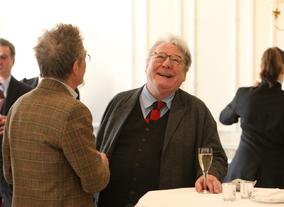 Actor John Hurt catching up with Alan Parker at Savoy, London.