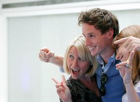 Eddie Redmayne posing for photos at the jury reception