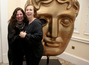 In front of the mask...