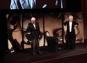 Lewis points his stick at a cameraman filming the event