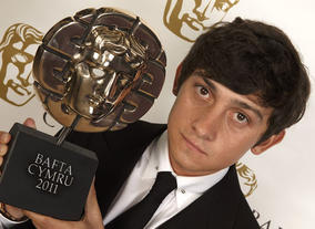 Best Actor winner for his role in Submarine, Craig Roberts poses with his BAFTA Cymru Award