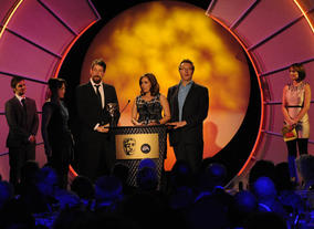 Tony Reed, Helen Stephens and Dominic Minns receive the BAFTA for the beautifully designed and entertaining ZingZillas. (Pic: BAFTA/Steve Finn)