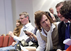 The contestants prepare for their three-minute pitches in front of the expert panel.