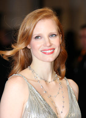 The Help star and Supporting Actress nominee wearing a metallic Oscar De La Renta gown, accessorised with Jimmy Choo shoes. 