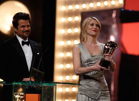 Bollywood actor Anil Kapoor and actress Claire Danes present the award for Costume Design (BAFTA/Brian Ritchie).