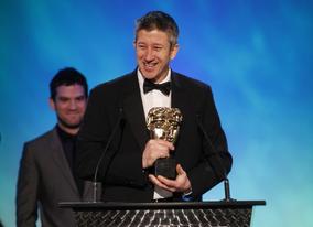 Keith Ramsdale makes an acceptance speech on behalf of the creators behind winning game in the Use of Online Category FIFA 10 (BAFTA/Brian Ritchie)
