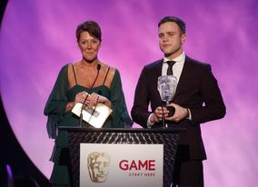 X-Factor runner-up Olly Murs and GAME CEO Lisa Morgan present the GAME Award of 2009 as voted for by the British public (BAFTA/Brian Ritchie)