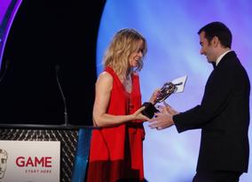 The development team behind Uncharted 2: Among Thieves join Edith Bowman onstage to accept their third award of the evening for best Original Score (BAFTA/Brian Ritchie)