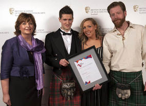 Winner for Entertainment: The State of Greenock, Gavin Grant, Pamela Barnes and David Newman, presented by Fiona Hyslop MSP, Cabinet Secretary for Culture and External Affairs