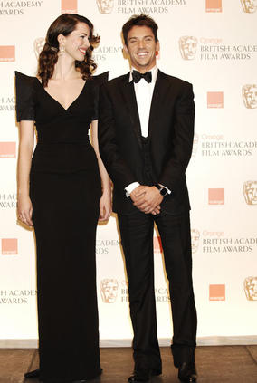 Star of Frost/Nixon and Dorian Gray, Rebecca Hall, stands with The Tudors star Jonathan Rhys Myers who presented the award for Production Design (BAFTA/Richard Kendal).