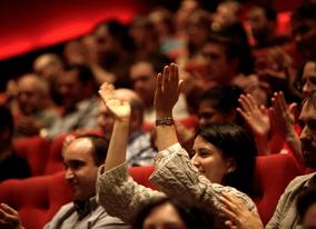 An audience at 195 Piccadilly applaudes the show