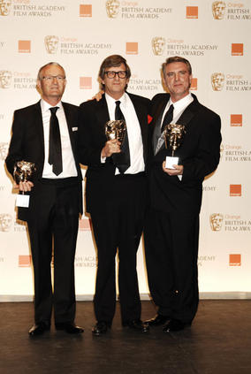 Rick Carter, Robert Stromberg and Kim Sinclair stand with their awards for Production Design on Avatar (BAFTA/Richard Kendal).