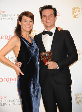 Andrew Scott, winner of the Supporting Actor BAFTA for his performance as Moriarty in Sherlock, poses with presenter Helen McCrory. 
