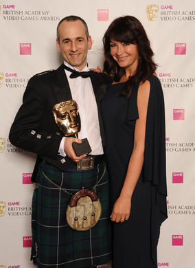 Presenter Suzi Perry with Colin Blackwood of Electronic Arts. The jury described the game’s sound as offering “a dramatic and powerful sense of perspective and space.”