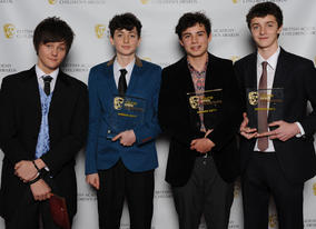 BYGD ambassador Tyger Drew-Honey with the Nose Dive Studios team and their award for Rollin' Scotch.