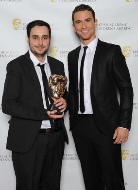 Presenter Richard Fleeshman with one of the winning Development Team members of LEGO Pirates of the Caribbean.