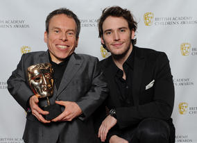 Harry Potter star Warwick Davies (Professor Flitwick) with presenter Sam Claflin.