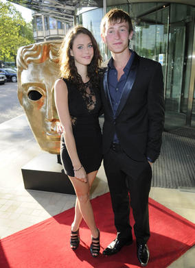 Skins actor Kaya Scodelario arrives on the TV Craft Awards red carpet with Shameless star Elliott Tittensor to present the BBC Blast and BAFTA Screen-Skills Award. 