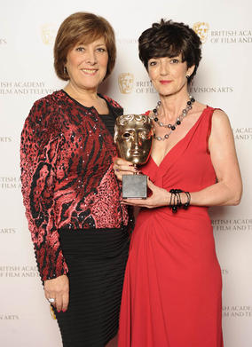 Winner of the Production Design BAFTA for Gracie!, Claire Kenny, with category presenter, actress Lynda Bellingham.