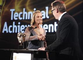 Vicki Butler Henderson is welcomed on stage by Vic Reeves to present the Award for Technical Achievement