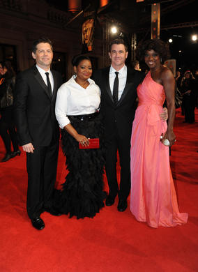The Help producer Brunson Green, actress Octavia Spencer, director Tate Taylor and actress Viola Davis. The film is nominated for five BAFTAs including Best Film, Leading Actress and Supporting Actress. Davis is wearing a dress by Valentino, shoes by Jimmy Choo and Bvlgari jewellry. Spencer is in a Tadashi Shoji dress.