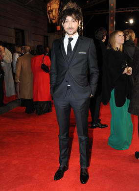 Sky Movies' film buff Alex Zane will be presenting BAFTA's backstage show, The Final Word. he's pictured here wearing a suit by The Kooples. 
