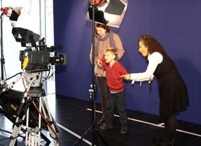 Children enjoyed experimenting with the blue screen prior to the screening of Disney's A Christmas Carol.