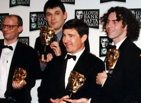 Geoffrey Perkins celebrates at the Television Awards in 1996 with the Father Ted team. 