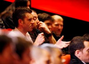 Audience members ask Nolan Bushnell questions about his career in video games.