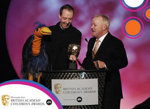 Ceremony host Keith Chegwin with Emu at the British Academy Children's Awards in 2007. 
