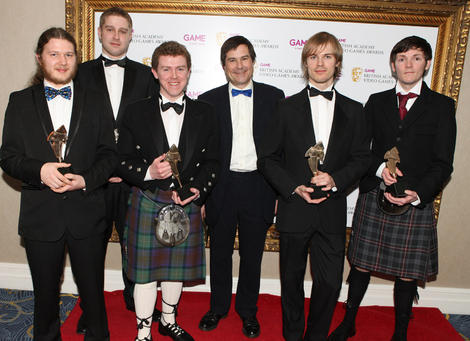 The Butterflyers team display their BAFTA Ones to Watch Award in Association with DARE to be Digital for their innovative platfom game Shrunk! (BAFTA/Steve Butler).